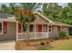 Charming home with red shutters and a cozy, white picket fence porch at 170 Hidden Pines Dr, Covington, GA 30016