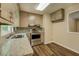 Kitchen with stainless steel appliances, granite countertops, and neutral cabinets at 170 Hidden Pines Dr, Covington, GA 30016