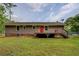 Back of house with backyard, deck, and siding at 170 Hidden Pines Dr, Covington, GA 30016