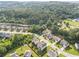 Aerial view of neighborhood featuring mature trees and landscaping at 1730 Dahlia Dr, Cumming, GA 30040