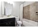 Standard bathroom includes a single sink vanity, toilet, and shower-tub combo with tile surround at 1730 Dahlia Dr, Cumming, GA 30040