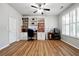 Versatile bedroom with built-in bookshelves, a ceiling fan, and natural light from large windows at 1730 Dahlia Dr, Cumming, GA 30040