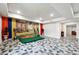 Open-concept living room featuring decorative instruments and a mural with a natural outdoor scene at 1730 Dahlia Dr, Cumming, GA 30040