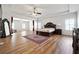 Spacious main bedroom with decorative rug, tray ceiling and expansive layout with sitting area at 1730 Dahlia Dr, Cumming, GA 30040