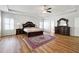 Main bedroom showcasing a decorative rug, elegant furniture, and windows providing natural light at 1730 Dahlia Dr, Cumming, GA 30040