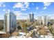 Stunning aerial view showcases the cityscape and surrounding lush greenery at 2479 Peachtree Ne Rd # 1703, Atlanta, GA 30305