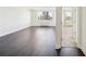 Bedroom featuring dark hardwood floors, a large window and a partial view into the room next door at 2479 Peachtree Ne Rd # 1703, Atlanta, GA 30305