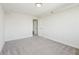 Bright bedroom with carpet floors, white walls, and a door leading to another room at 2479 Peachtree Ne Rd # 1703, Atlanta, GA 30305
