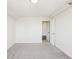 Bright bedroom with carpet floors, white walls, and a door leading to another room at 2479 Peachtree Ne Rd # 1703, Atlanta, GA 30305