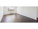 Bright bedroom featuring dark hardwood floors and a large window with city views at 2479 Peachtree Ne Rd # 1703, Atlanta, GA 30305
