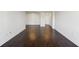 Spacious living room with dark hardwood flooring, modern fixtures, and white trim at 2479 Peachtree Ne Rd # 1703, Atlanta, GA 30305