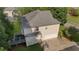 Home's backyard shows siding, wooden deck and stairs, and a two car garage with driveway at 6057 Glencedar Ln, Atlanta, GA 30349