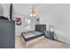 Simple bedroom with carpeted floors, a bed frame, and a window with natural light at 6057 Glencedar Ln, Atlanta, GA 30349