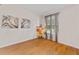 Bright bedroom with hardwood floors and natural light streaming through the window at 6057 Glencedar Ln, Atlanta, GA 30349
