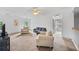 Bright bonus room with carpet, featuring a sitting area and doorway access at 6057 Glencedar Ln, Atlanta, GA 30349