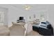 Spacious bonus room with carpet, television, and seating, providing a versatile living space at 6057 Glencedar Ln, Atlanta, GA 30349