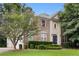 Beautiful brick house with green lawn, a mix of brick and stucco, and a blue front door at 6057 Glencedar Ln, Atlanta, GA 30349