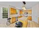 Well-lit kitchen features oak cabinets, granite counters, and stainless steel appliances at 6057 Glencedar Ln, Atlanta, GA 30349