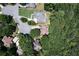Aerial shot of a neighborhood with mature trees and homes with backyard patio areas at 6185 Masters Club Dr, Suwanee, GA 30024