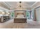 Large bedroom with decorative ceiling and lighting, neutral paint and plenty of natural light at 6185 Masters Club Dr, Suwanee, GA 30024