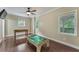 Spacious bonus room with hardwood floors, ceiling fan, and game tables at 6185 Masters Club Dr, Suwanee, GA 30024