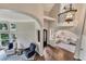 Bright foyer with hardwood flooring, arched doorways, and stylish decor at 6185 Masters Club Dr, Suwanee, GA 30024