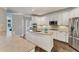 Well-appointed kitchen with white cabinetry, stainless steel appliances, granite countertops, and a functional island at 6185 Masters Club Dr, Suwanee, GA 30024