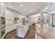 Spacious kitchen featuring white cabinets, granite countertops, stainless appliances, and a central island at 6185 Masters Club Dr, Suwanee, GA 30024