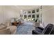 Bright sitting room with large windows, hardwood floors, and comfortable seating area at 6185 Masters Club Dr, Suwanee, GA 30024