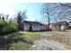 View of detached home with white siding in a spacious backyard at 692 Moreland Se Ave, Atlanta, GA 30316