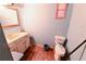 Bathroom with a sink, toilet, and towel rack at 692 Moreland Se Ave, Atlanta, GA 30316