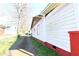 Side view of a white house with red trim and a gravel driveway at 692 Moreland Se Ave, Atlanta, GA 30316