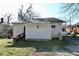 Back of a detached home with white siding and a small window at 692 Moreland Se Ave, Atlanta, GA 30316