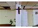 Interior view showcasing a cross on a white column, with a partial view of a drop ceiling at 692 Moreland Se Ave, Atlanta, GA 30316