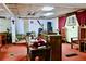 Traditional sanctuary featuring rows of seating, a wooden podium, and instruments at 692 Moreland Se Ave, Atlanta, GA 30316