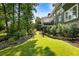 Landscaped backyard featuring well-manicured lawn, mature trees, and privacy creating a serene outdoor space at 1164 Bonview Ne Ln, Atlanta, GA 30324