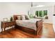 Relaxing bedroom features hardwood floors, a window bench, and ample natural light at 1164 Bonview Ne Ln, Atlanta, GA 30324