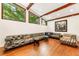 Bright living room with hardwood floors, exposed beams, and ample natural light at 1164 Bonview Ne Ln, Atlanta, GA 30324