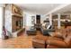 Spacious living room with stone fireplace, comfortable seating, and views of a lower level billiards area at 1164 Bonview Ne Ln, Atlanta, GA 30324