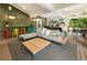 Spacious outdoor patio with a cozy seating area, a bar, outdoor dining, and outdoor kitchen at 1164 Bonview Ne Ln, Atlanta, GA 30324