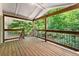 Expansive outdoor deck features wood flooring, railing, and natural views at 449 Clairemont Ave # H3, Decatur, GA 30030