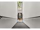 Hallway showcasing stairs leading up to an apartment with railing and a bright skylight at 449 Clairemont Ave # H3, Decatur, GA 30030