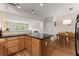 Kitchen with breakfast bar, wooden cabinets, stainless appliances and hardwood floors at 449 Clairemont Ave # H3, Decatur, GA 30030