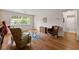 Cozy living room features hardwood floors, large window and a view of the trees at 449 Clairemont Ave # H3, Decatur, GA 30030