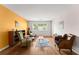 Bright living room boasts hardwood floors, a colorful accent wall and ample natural light at 449 Clairemont Ave # H3, Decatur, GA 30030