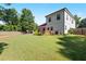 Expansive backyard features lush grass, mature trees, deck, privacy fence, and landscaping at 1967 Cogar Dr, Decatur, GA 30032