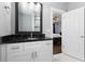 Stylish bathroom features a granite countertop, modern vanity, decorative lighting, and tile flooring at 1967 Cogar Dr, Decatur, GA 30032