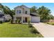 Charming two-story home featuring a well-manicured lawn and welcoming front porch at 1967 Cogar Dr, Decatur, GA 30032