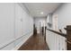 Hallway decorated with white trim and hardwood floors shows several doorways at 1967 Cogar Dr, Decatur, GA 30032