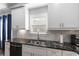 Modern kitchen design with granite countertops, stainless steel dishwasher, and subway tile backsplash at 1967 Cogar Dr, Decatur, GA 30032